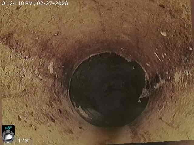 Performed comprehensive camera inspection of sewer line, documenting significant buildup of debris and mineral deposits at distances of 10'4" and 11'9" from access point. Replaced compromised underground pipe section causing blockages and successfully cleaned basement sink line to restore proper drainage function.