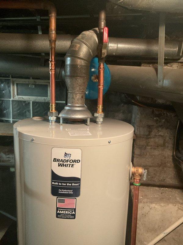 Conducted on-site assessment of leaking water heater. Inspected existing GE SmartWater unit showing significant rust staining and deterioration along top edge. Provided replacement estimate for new Bradford White water heater, including necessary copper pipe reconnections, vent pipe installation, and proper drainage setup to resolve current leakage issue.