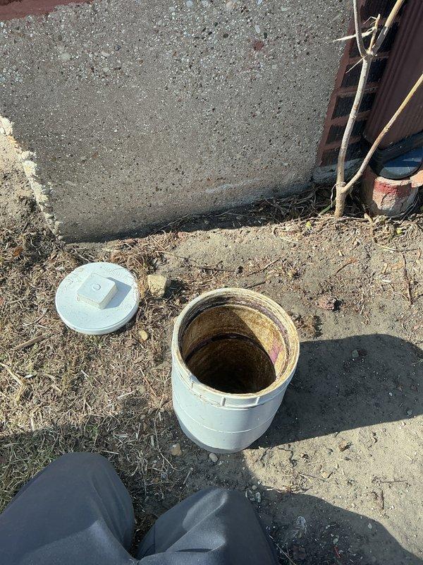 Responded to callback request to televise main sewer line. Inspected the area around the foundation where access point was located, and performed camera inspection of the sewer pipe. Images revealed circular concentric rings along the pipe interior with visible moisture/condensation and some mineral deposits, suggesting potential scaling or root intrusion narrowing the pipe diameter toward the outlet.