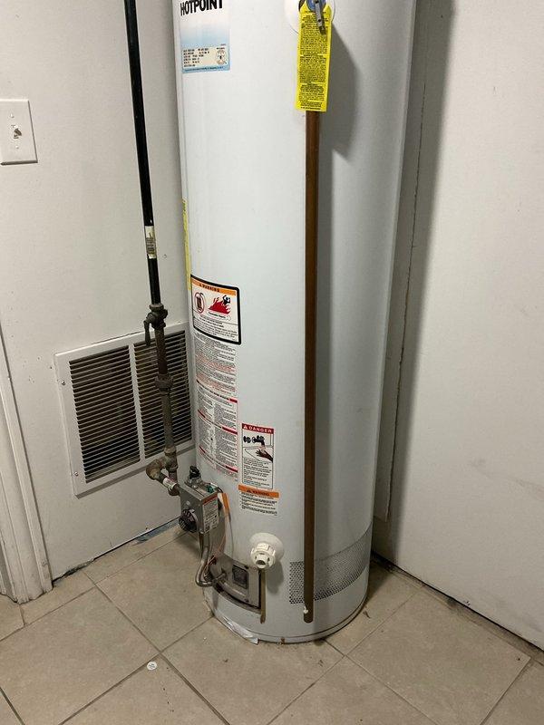 Responded to service call for toilet not flushing properly and backing up, an issue that began approximately two weeks prior. Inspected water heater for potential replacement with a tanked unit and evaluated dishwasher drainage connection requirements. Completed necessary repairs to restore proper toilet function and documented current plumbing configuration with photos for future reference.