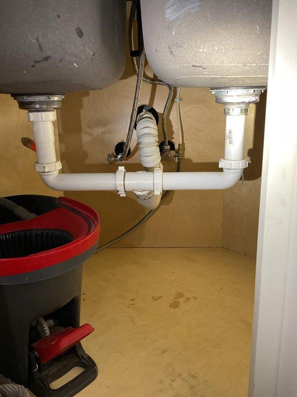 Responded to service call for toilet not flushing properly and backing up, an issue that began approximately two weeks prior. Inspected water heater for potential replacement with a tanked unit and evaluated dishwasher drainage connection requirements. Completed necessary repairs to restore proper toilet function and documented current plumbing configuration with photos for future reference.