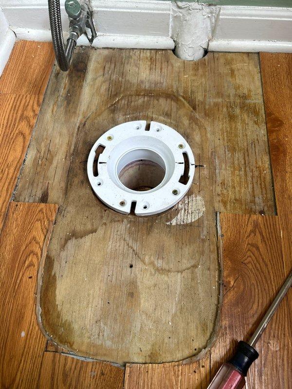 Responded to service call for a continuously running toilet that was flagged by city water meter. Upon inspection, discovered significant water damage to subfloor surrounding the toilet flange. Removed toilet, cleared deteriorated wax ring and debris from flange area, and installed new toilet with proper sealing to prevent future leakage. Confirmed proper operation and water flow cessation when not in use.