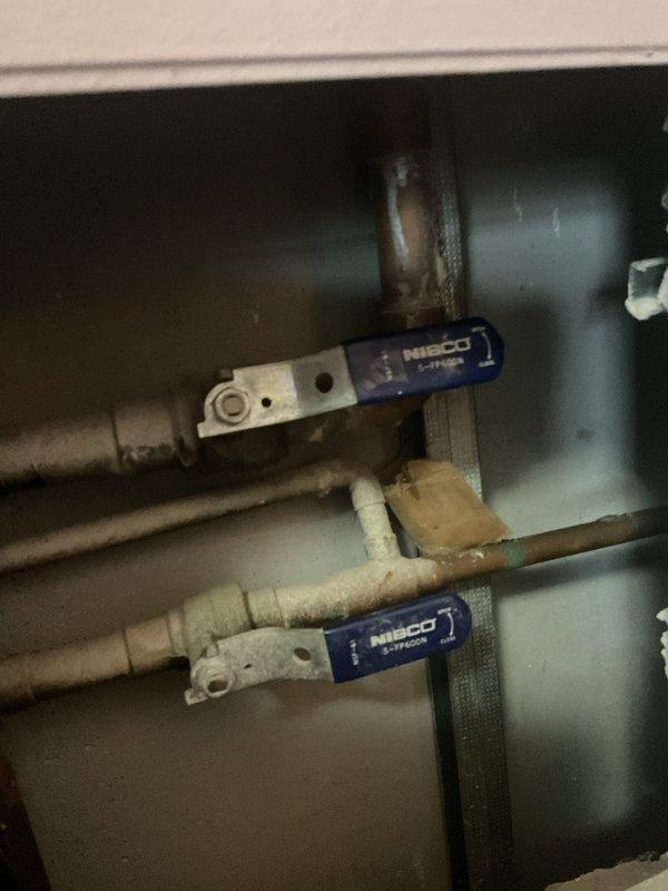 Responded to service call regarding delayed hot water delivery to shower. Inspected plumbing system and identified NIBCO valve configuration in utility access area that was partially restricting flow. Adjusted valve positions to restore proper water pressure and improve hot water delivery time to fixture.