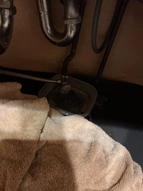 Responded to service call for leak under kitchen sink at dishwasher connection. Inspected the plumbing system, including P-trap and supply lines, and identified water damage on the wall near the connection point. Repaired the leaking dishwasher hookup by replacing the damaged fitting and tested the system to confirm proper function with no further leakage.