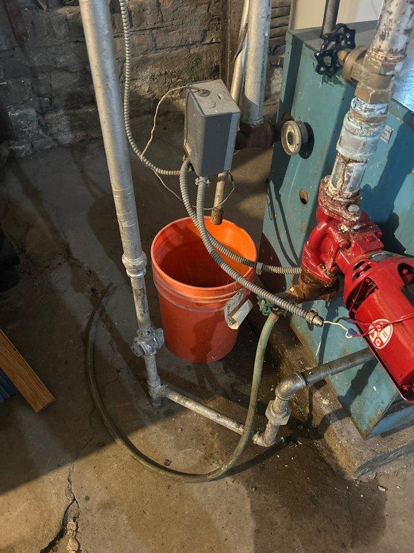 Responded to service call regarding water heater making loud popping sounds. Inspection revealed significant corrosion and mineral buildup on the pump assembly connected to the water heater. Customer approved full payment for replacement pump, which will be ordered, and customer will be notified when parts arrive.