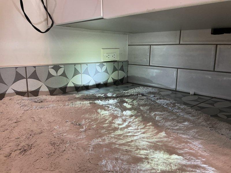Scheduled installation of toilet in customer's bathroom with modern subway tile and glass shower enclosure. Confirmed 50% deposit received for work to be performed next week. Job requires two-person team for proper installation.