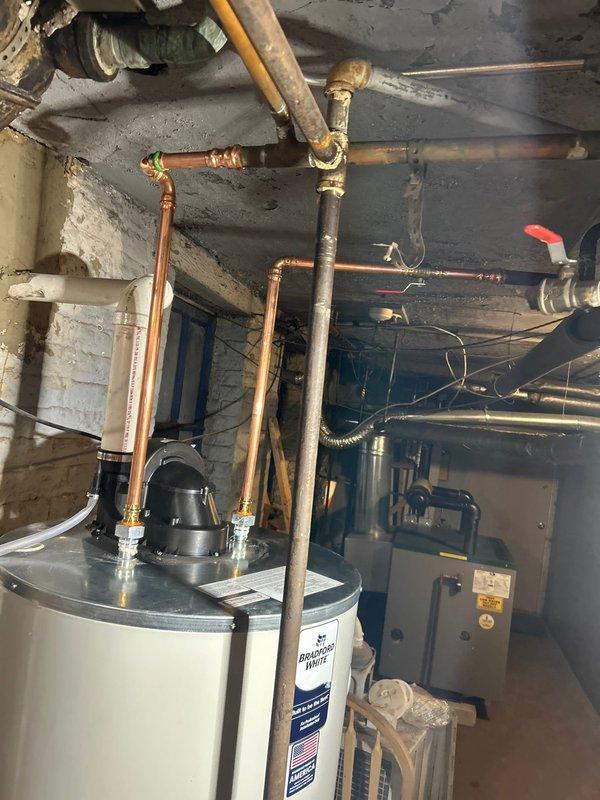Successfully installed new tanked water heater in basement utility room, connecting all required copper supply lines and ensuring proper integration with existing HVAC system. Completed all necessary pipe fittings and verified proper operation before finalizing installation.