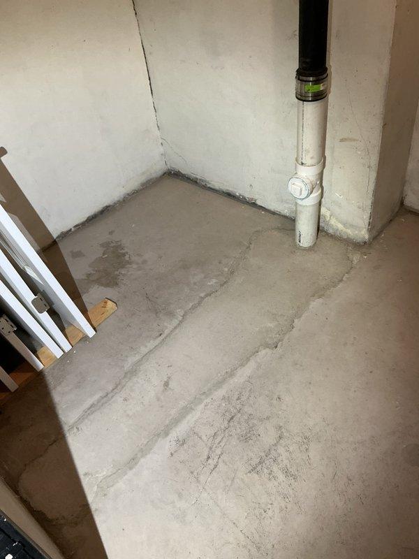 Conducted inspection of residential basement in response to reported persistent sewer odor. Examined PVC drain pipe connections and fittings at wall junction where green level indicator is present. Inspected HVAC ductwork and surrounding area for potential cross-contamination issues. Photos taken of plumbing configuration and adjacent utility spaces for assessment of remediation options to resolve ongoing sewer smell.