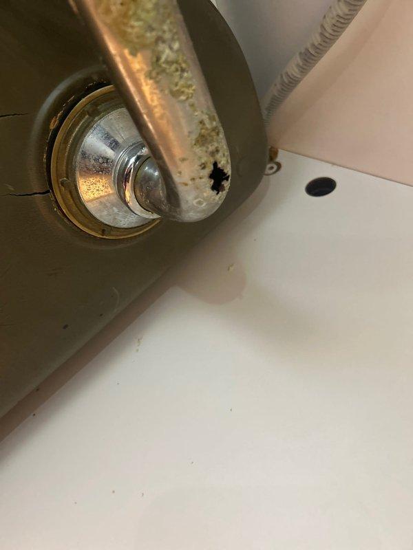 Completed VIP maintenance service on tankless water heater system, including descaling and inspection of components. Repaired broken drain pipe under double sink which showed significant corrosion and mineral buildup, replacing the affected P-trap assembly and horizontal drain section to resolve active leak.