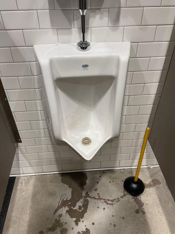 Performed camera inspection of backed-up urinal and identified significant corrosion and mineral buildup in the drain pipe causing recurring blockage. Conducted hydro jetting service to clear immediate obstruction and inspected remaining urinals on site to ensure proper drainage.