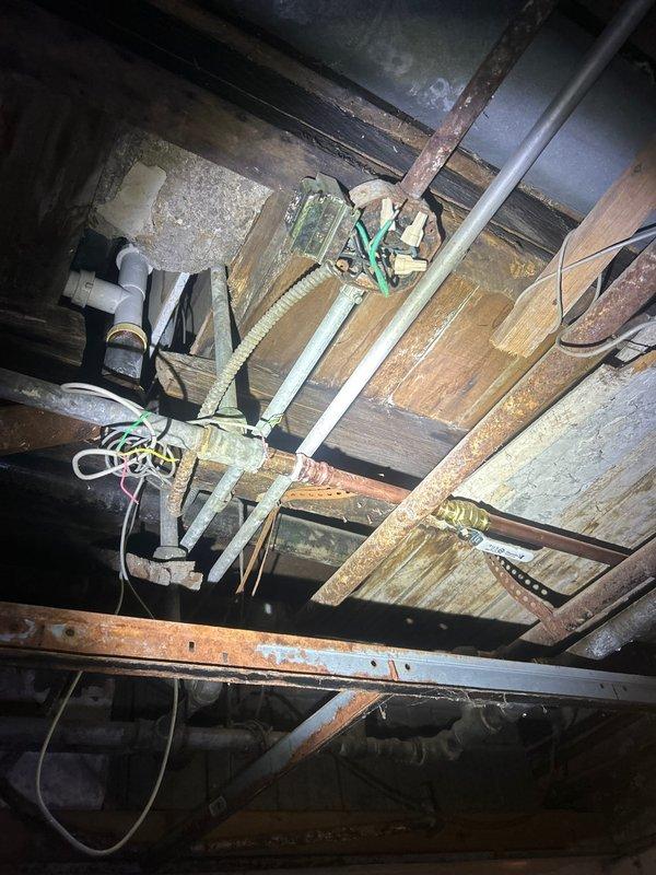 Responded to customer complaint regarding non-functioning bathtub faucet. Upon inspection of the plumbing access area, identified severe corrosion on copper supply lines and improper installation of previous plumbing components. Replaced deteriorated piping sections, installed new faucet valve assembly, and tested water flow to ensure proper operation and no leaks.