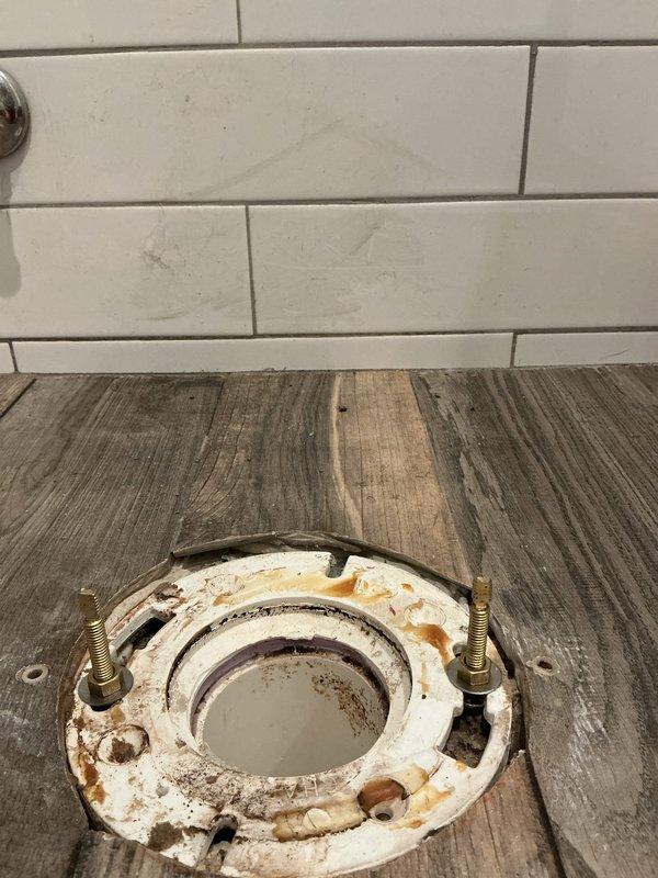 Completed installation of customer-supplied bidet toilet. Upon removal of old fixture, discovered aged and degraded wax ring with significant discoloration and rust stains around the toilet flange. Cleaned mounting area, replaced wax ring, and properly secured new bidet toilet to existing flange using brass mounting bolts. Tested for proper function and verified no leaks.