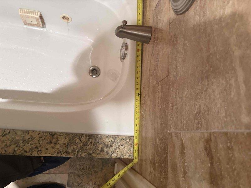 Responded to emergency bathroom leak in 50-year-old residential property. Upon inspection, identified water seepage around sink basin where countertop meets wall tile. Removed affected section of granite countertop, replaced deteriorated caulking and sealed junction points, then reinstalled countertop with proper waterproof barrier to prevent future moisture intrusion.