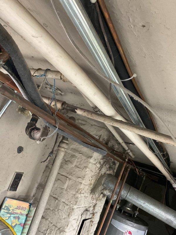 Responded to service call for a clogged utility sink in basement backing up with water, potentially connected to first floor kitchen sink drainage issue. Inspection of the plumbing system revealed buildup in the drain line between floors. Successfully cleared the blockage, restoring proper drainage to both the basement utility sink and kitchen sink.