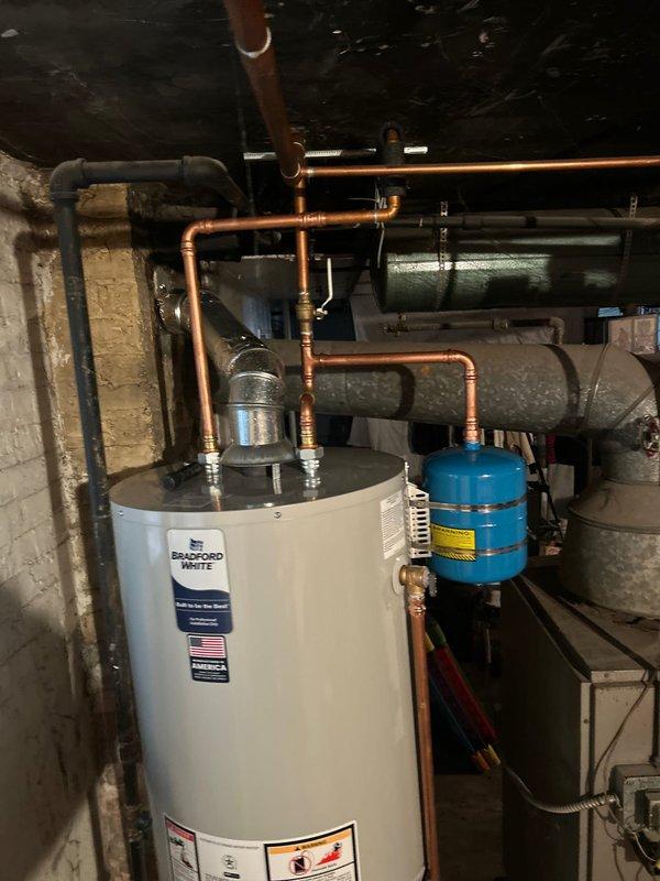 Responded to same-day service request for a leaking water heater. Successfully replaced customer's existing Bradford White unit with a new 50-gallon atmospheric Rheem water heater. Installation included proper connection of copper supply lines and verification of system functionality.