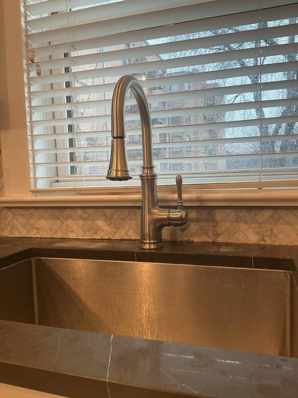 Successfully replaced customer's kitchen faucet as requested. Removed old fixture and installed new high-arc stainless steel faucet with pull-down sprayer. Verified proper function of new installation and ensured no leaks at connection points to existing plumbing system.