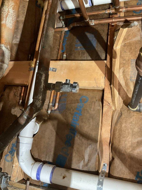 Completed service job involving drain cleaning with rodding and camera inspection of plumbing system. Examined exposed copper supply lines showing oxidation and PVC drainage pipes with proper primer application in wall cavity. Inspected basement drainage infrastructure with focus on PVC piping connections and alignment with existing galvanized ductwork.