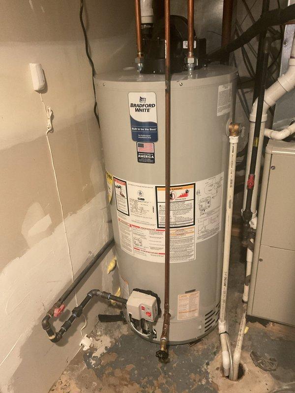 Conducted water leak investigation at customer's request due to high water bill. Inspected two toilets with suspected faulty flappers (customer-supplied replacements), examined kitchen area including pot filler faucet installation, and assessed water heater system for possible leaks. Rodded multiple drain pipes to ensure proper drainage. Replaced kitchen faucet with customer-supplied fixture.
