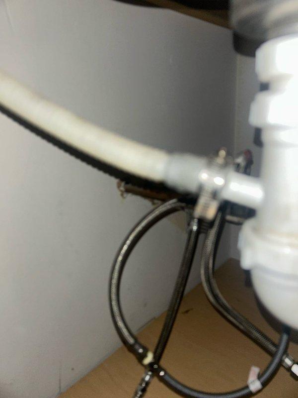Responded to service call for low hot water pressure affecting kitchen faucet and dishwasher. Diagnosed issue with mineral deposits restricting flow in hot water supply lines. Cleaned and flushed affected supply lines, inspected braided hoses for damage, and verified equal pressure between hot and cold lines after service.