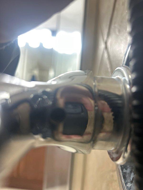 Conducted inspection of plumbing fixtures in condo unit, identifying 6-8 angle valves under sinks requiring replacement and a shower valve and trim needing replacement. Noted that shower handle removal will require drilling or breaking off, and coordinated with building management for water shut-off scheduling as unit lacks local shut-off valves.