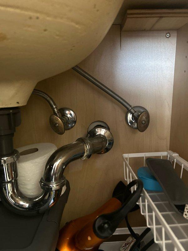 Conducted inspection of plumbing fixtures in condo unit, identifying 6-8 angle valves under sinks requiring replacement and a shower valve and trim needing replacement. Noted that shower handle removal will require drilling or breaking off, and coordinated with building management for water shut-off scheduling as unit lacks local shut-off valves.