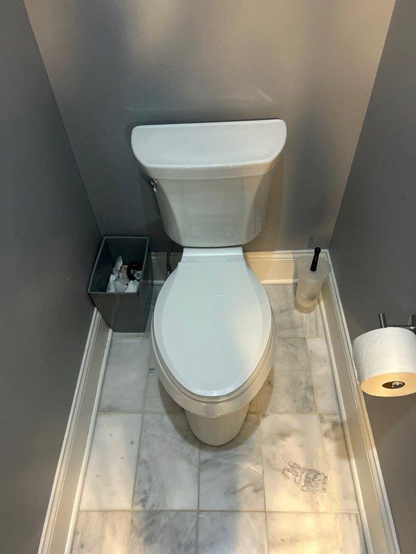 Responded to service call for leaking toilet in master bathroom. Diagnosed issue with deteriorated wax ring seal causing water seepage around floor drain. Removed toilet, replaced wax ring and rubber seal, then reinstalled and tested fixture for proper function and no leakage.