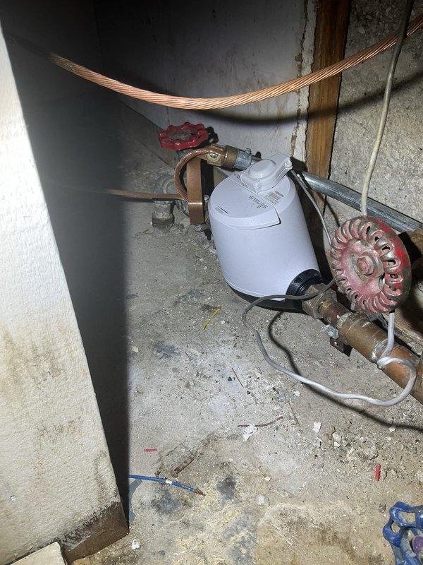 Conducted comprehensive assessment and replacement of lead supply piping in utility area, along with installation of new backflow prevention device. Removed aging copper pipes showing significant oxidation and replaced deteriorating valve components. System now features updated pressure regulation and compliant backflow protection to ensure water safety standards are met.