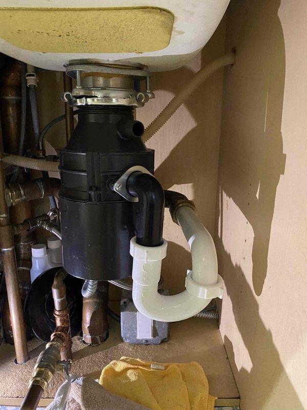 Diagnosed and replaced faulty garbage disposal unit in kitchen of 20-year-old condo. Properly installed new disposal with appropriate connections to existing drain system, ensuring proper alignment and sealing at the sink collar mount. Tested system functionality with water flow to confirm complete resolution of the week-long operational issue.