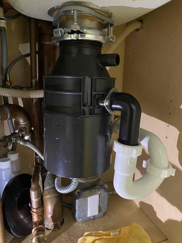 Diagnosed and replaced faulty garbage disposal unit in kitchen of 20-year-old condo. Properly installed new disposal with appropriate connections to existing drain system, ensuring proper alignment and sealing at the sink collar mount. Tested system functionality with water flow to confirm complete resolution of the week-long operational issue.