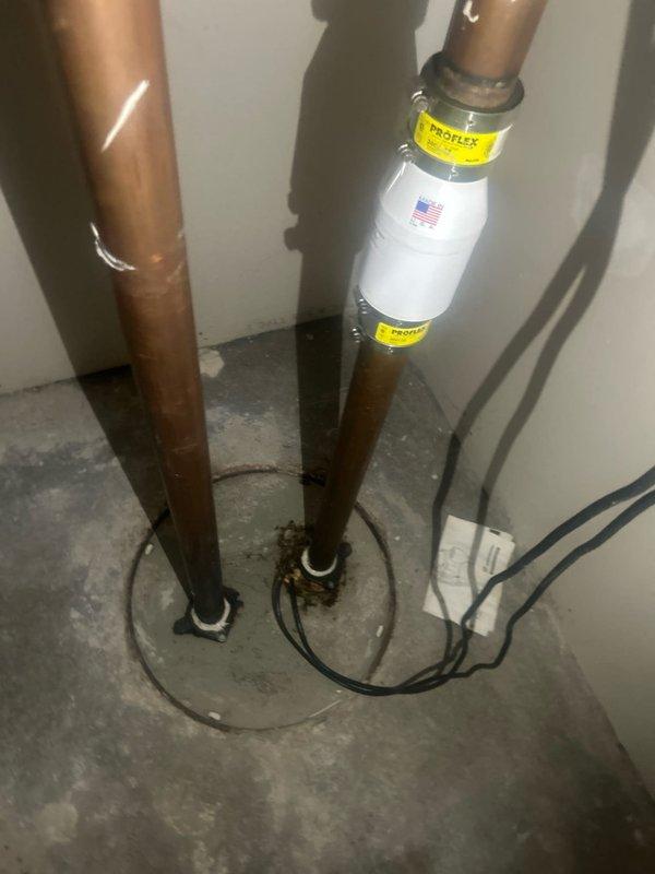 Inspected morning ejector pump system and identified severe corrosion and rust damage at pipe connection joints. Observed compromised galvanized steel piping with significant deterioration at valve assembly. Installed ProFlex water hammer arrestor on copper supply lines to resolve pressure fluctuation issues and prevent future system damage.