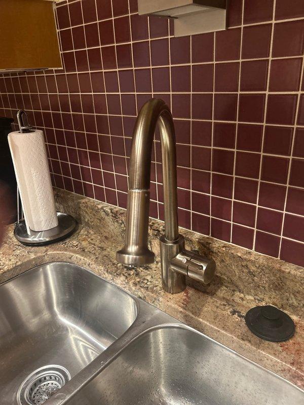 Responded to service request for kitchen faucet cartridge replacement. Upon inspection of the double-basin stainless steel sink with brushed nickel faucet, diagnosed faulty cartridge causing water flow issues. Successfully replaced cartridge, verified proper operation, and checked supply lines for leaks to ensure complete resolution of the reported problem.