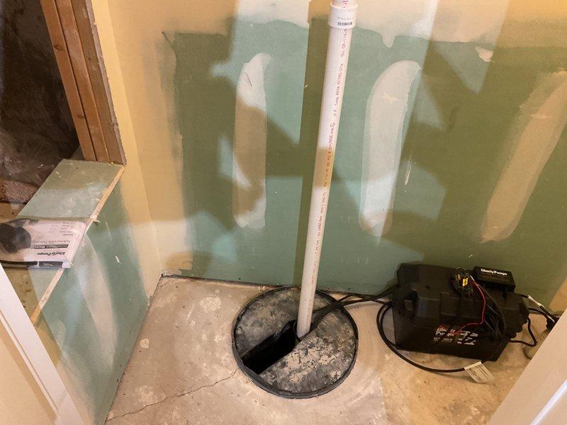 Installed replacement Liberty Pumps backup system on existing sump pump installation. Verified proper operation of system with water present in sump pit. Confirmed PVC discharge pipe connections were secure with no leaks detected.