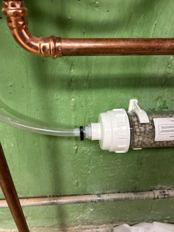 Responded to warranty service call for a leaking tankless water heater previously installed by our team. Inspected the system and identified leak at the copper pipe connection to the filtration system. Repaired the faulty connection and verified proper operation with no further leaks observed.