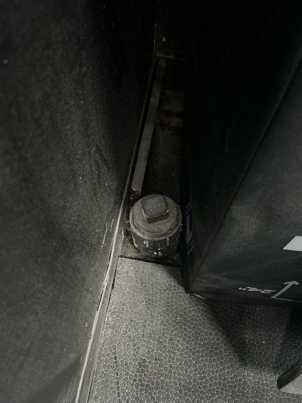 Inspected sump pump area after reports of odor. Discovered significant corrosion on horizontal pipe with rust deposits indicating long-term moisture exposure. Noted deterioration of metal components in the confined space requires attention to prevent system failure.
