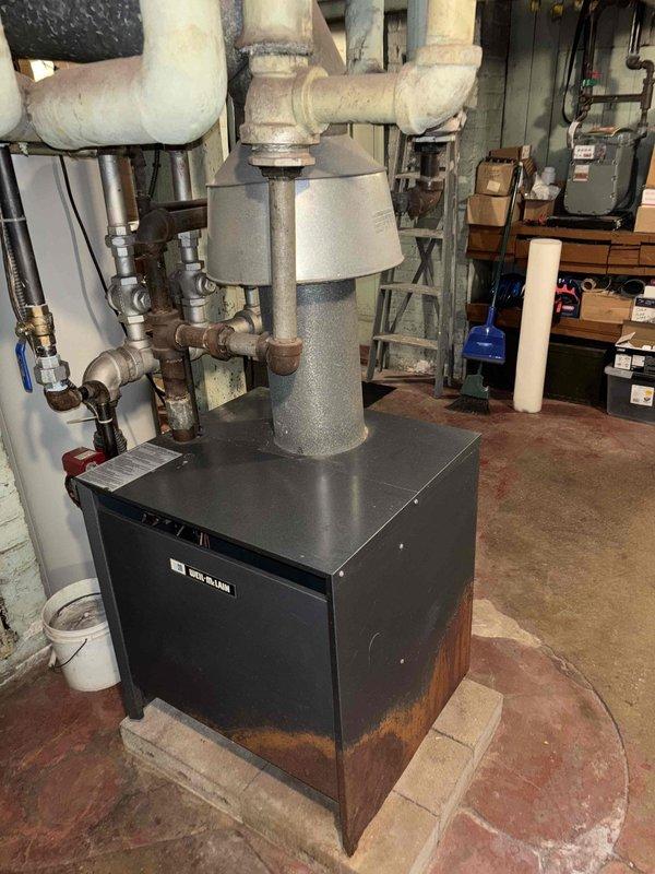 Responded to a VIP service call regarding a suspected gas leak in a 120-year-old residence. Conducted comprehensive pressure testing on the gas system, with particular focus on the Weil-McLain boiler unit showing significant rust along the base. Inspected associated PVC piping infrastructure, including deteriorated connections near the ceiling-wall junction, and successfully identified and addressed the source of the gas leak to restore safe operation of the system.
