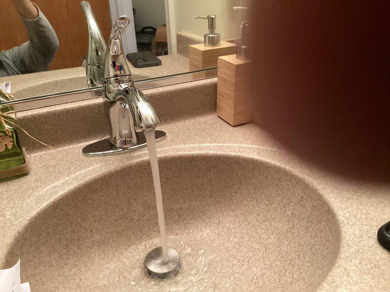 Successfully installed new bathroom faucet as requested in afternoon appointment. Verified proper water flow and drainage after installation, with no leaks observed at connection points. T-junction fitting was replaced during installation to ensure optimal performance.