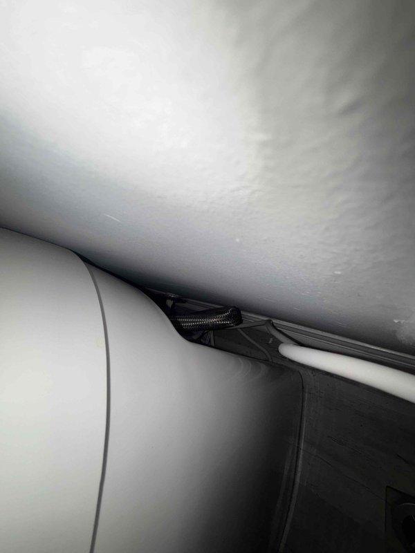 Diagnosed and serviced smart toilet exhibiting unusual operational noise and erratic behavior. Inspected ceiling junction area where control wiring connects to unit, and examined interior panel connections. Resolved issue by securing loose connections and recalibrating system settings.