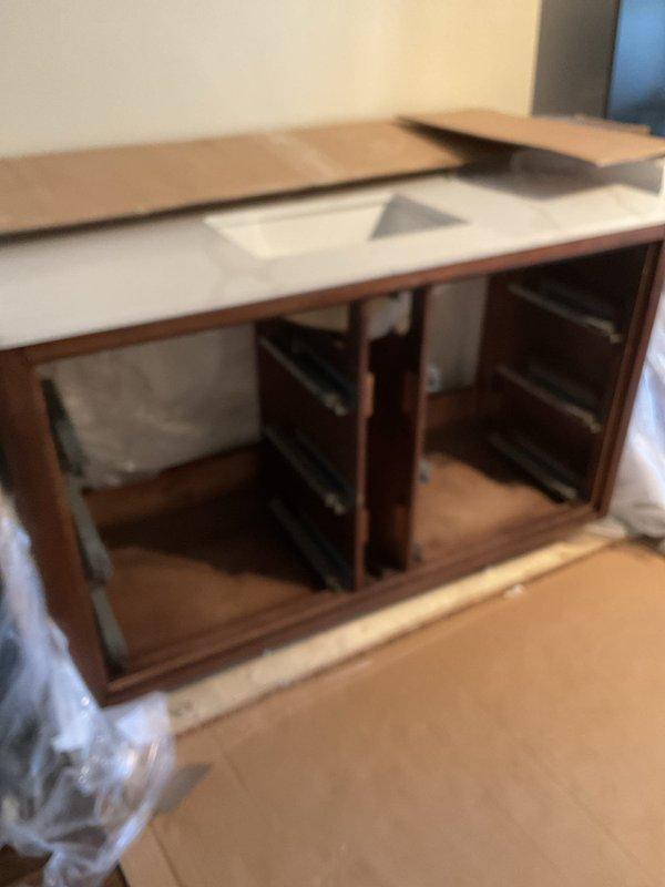 Removed drywall to access plumbing for shower/tub installation, exposing copper supply lines and drainage system. Installed green valve fixture and prepared the area for vanity installation in phase 2 of the project, which will commence upon client notification.