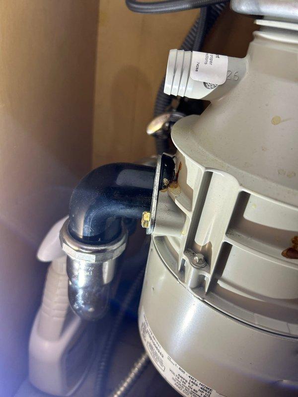 Successfully installed customer-supplied garbage disposal unit beneath the sink, connecting it properly to existing drain system with new P-trap assembly and ensuring all supply lines were securely fastened. Completed installation with verification of proper drainage and operation, leaving the workspace clean with no leaks observed.