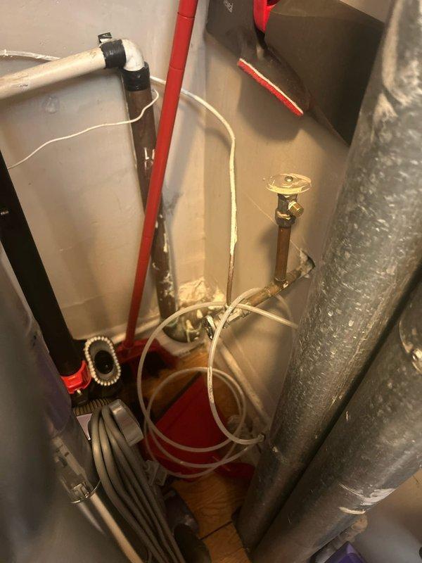Responded to a callback request to provide an estimate for plumbing work in kitchen area. Inspected under-sink plumbing components and utility space containing PVC and brass piping systems. Documented current installation with photos for reference in preparing comprehensive service proposal.