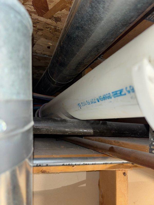 Successfully completed the scheduled repair service, installing new PVC drainage and supply lines within the structural framework of the ceiling/underfloor space. All piping components were properly secured with appropriate brackets and connected to the existing metal ductwork, ensuring proper functionality of the plumbing system.
