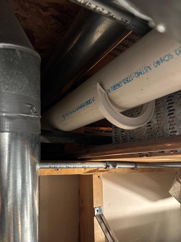 Successfully completed the scheduled repair service, installing new PVC drainage and supply lines within the structural framework of the ceiling/underfloor space. All piping components were properly secured with appropriate brackets and connected to the existing metal ductwork, ensuring proper functionality of the plumbing system.