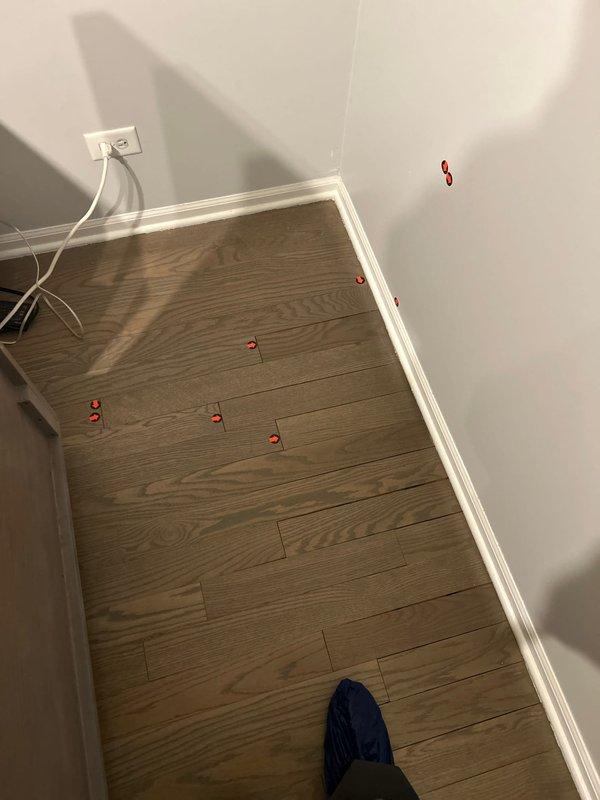 Conducted a comprehensive water leak detection inspection in response to customer's mold concerns. Utilized electronic leak detection equipment to identify and mark potential leak sources with red indicator dots at wall-floor junctions and along baseboards. Findings suggest moisture intrusion at marked locations, requiring further remediation to address both the water source and existing mold issues.