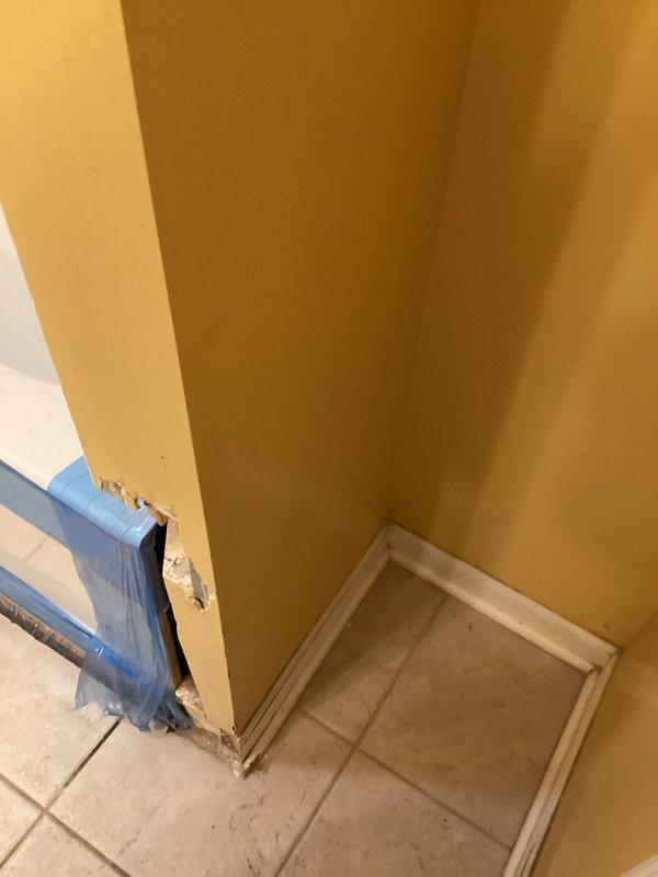 Responded to warranty service request for leaking shower and sink faucets. Discovered significant water damage to drywall near bathroom floor requiring repair, with visible deterioration and exposed interior wall material. Completed VIP maintenance service and conducted water test in bathtub to verify proper drainage and overflow functionality.