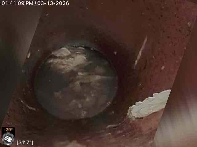 Performed camera inspection of main sewer line revealing significant rust, sediment buildup, and potential structural issues at approximately 3'7" into the line as previously identified during prior service visit. Completed necessary main line repair to address deterioration and prevent future blockages.