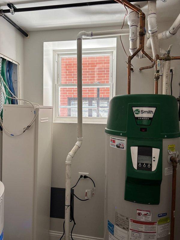 Performed scheduled sump pump system service and inspection at customer's property, with payment arrangement secured prior to work commencing. Conducted thorough assessment of basement drainage system, including sump pump, electronic controller, and associated PVC drainage pipes. Also inspected A.O. Smith Vertex water heater and surrounding plumbing infrastructure, ensuring all components were functioning properly and meeting manufacturer specifications.