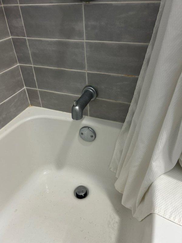 Responded to service call for bathroom plumbing issue where water was backing up into both tub and sink in the same bathroom. Upon inspection, discovered clogged drain line affecting multiple fixtures. Successfully cleared obstruction using professional-grade equipment, restoring proper drainage to all affected fixtures and verifying complete water flow.