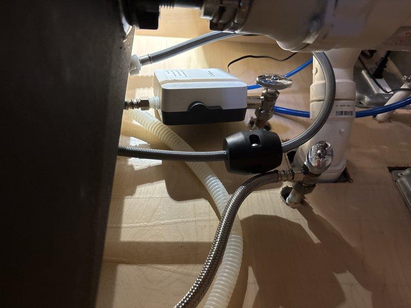 Conducted inspection of a 15+ year old 50-gallon water heater displaying significant corrosion on connecting pipes and requiring replacement. Noted building requires advance notification for water shutdown due to absence of in-unit shutoff valves. Additionally assessed kitchen sink with leaking faucet that may need replacement.