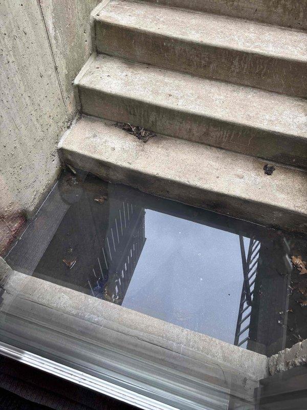 Replaced failed sump pump and ejector pump in basement area experiencing significant water accumulation at bottom of stairwell. Installed new PVC discharge piping with proper connections to existing drain system. Provided consultation on flood control system options to address recurring drainage issues.