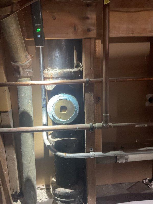Successfully performed mainline rodding from inside cleanout at the base of the main stack in crawl space using a 4" cutter to clear blockage. Completed follow-up camera inspection to verify proper flow restoration and documented work through video and photos of the plumbing system, which showed exposed piping infrastructure and some construction debris in the work area.